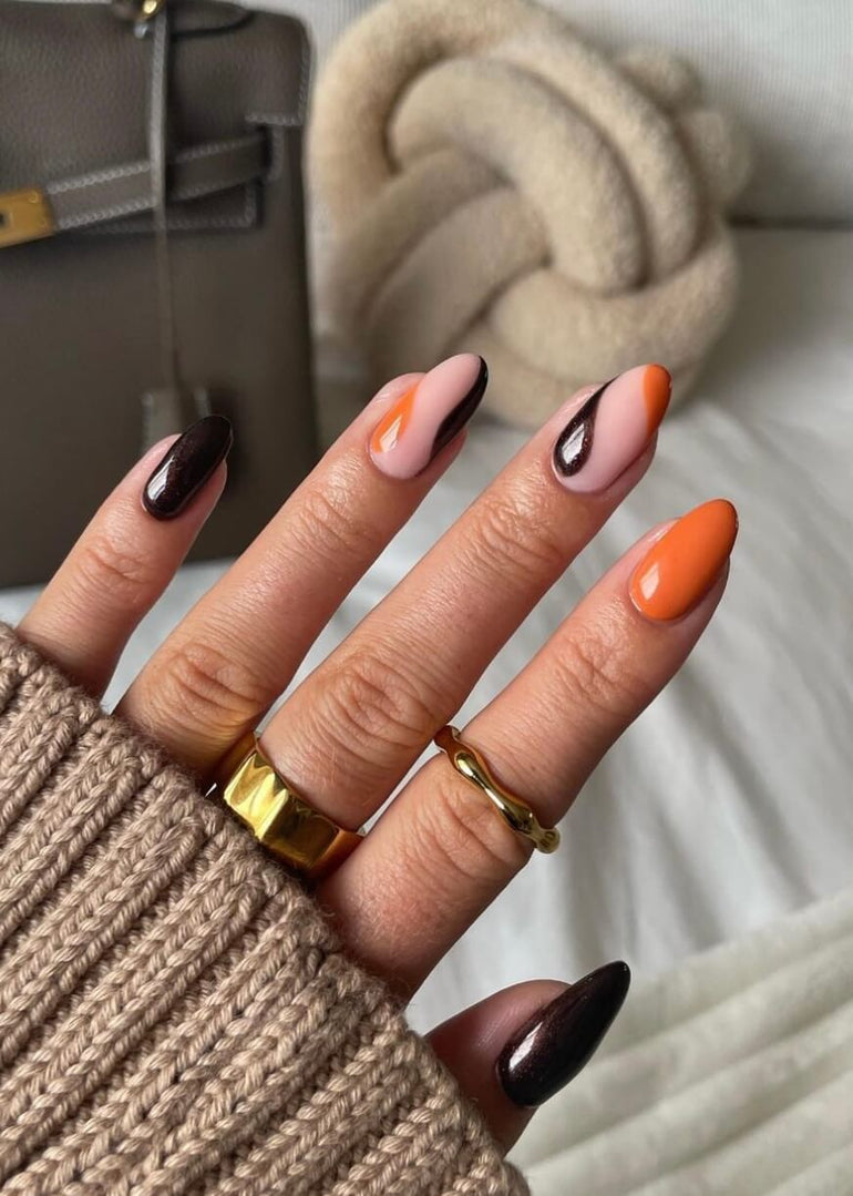 Deep brown and orange swirl nail art by Tori Watterson